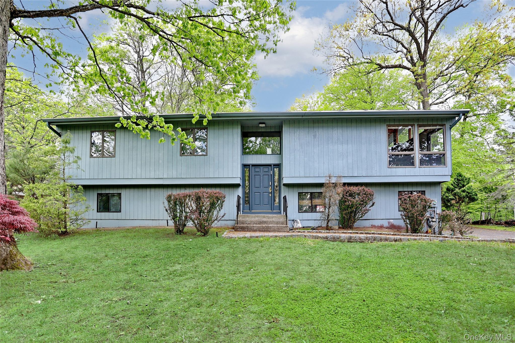 23 Sherwood Ridge Road Pomona, NY 10970 - Photo 1 of 28 a view of a house with a yard and a large tree