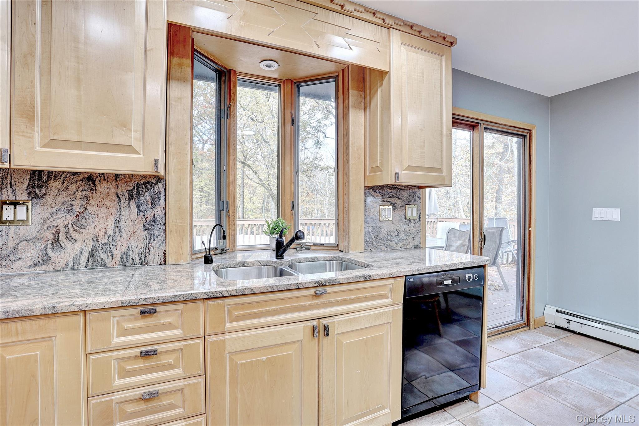 23 Sherwood Ridge Road Pomona, NY 10970 - Photo 12 of 28 a kitchen with granite countertop a sink and a window