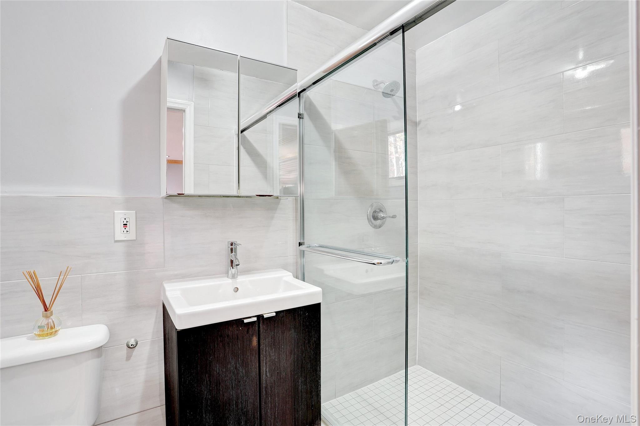 23 Sherwood Ridge Road Pomona, NY 10970 - Photo 15 of 28 a bathroom with a sink toilet and shower