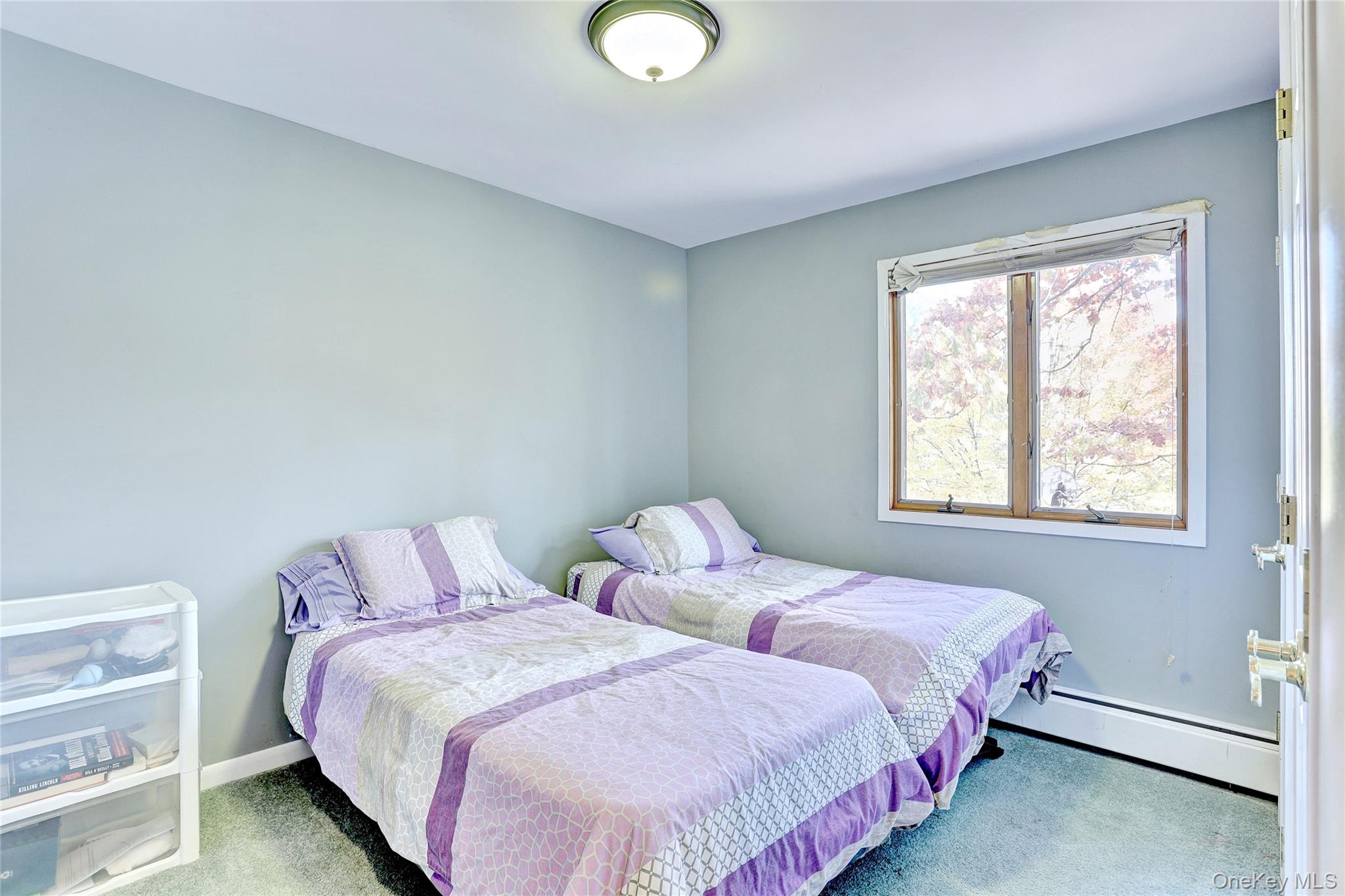 23 Sherwood Ridge Road Pomona, NY 10970 - Photo 17 of 28 a bedroom with two beds and a window