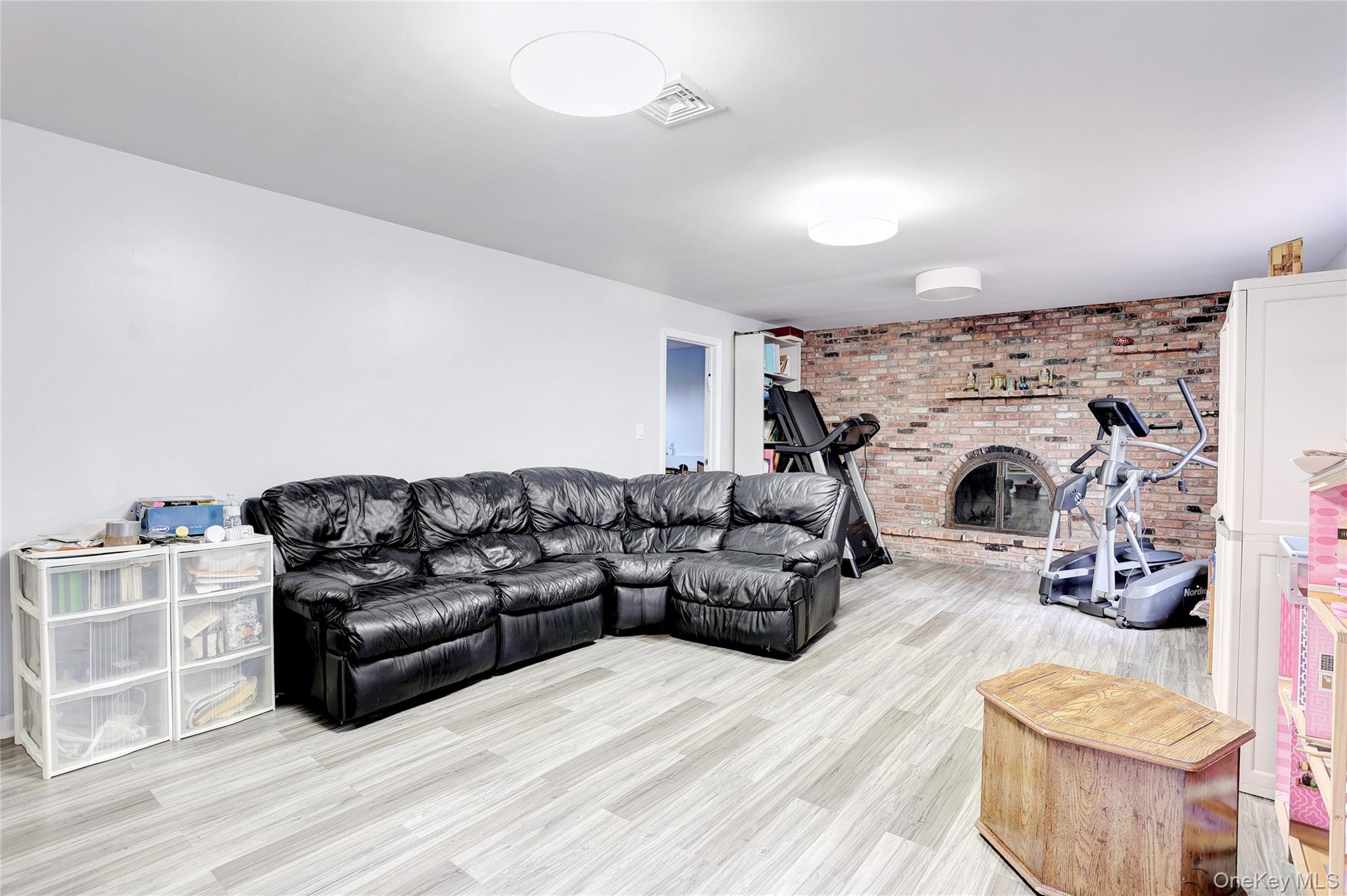 23 Sherwood Ridge Road Pomona, NY 10970 - Photo 19 of 28 a living room with furniture and a fireplace