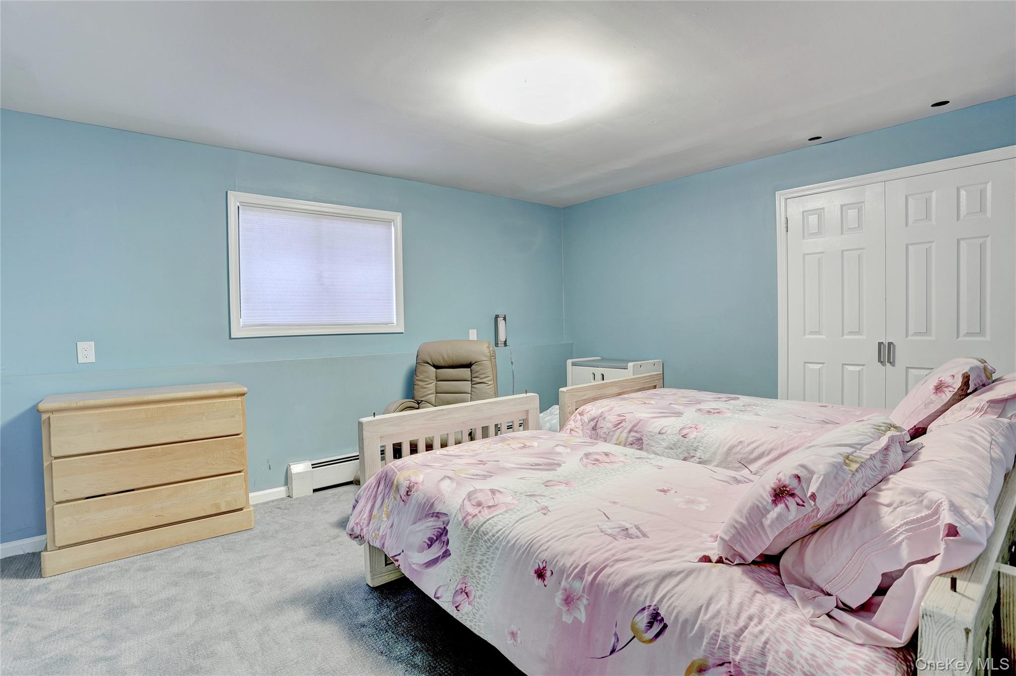 23 Sherwood Ridge Road Pomona, NY 10970 - Photo 21 of 28 a bedroom with a bed and a dresser