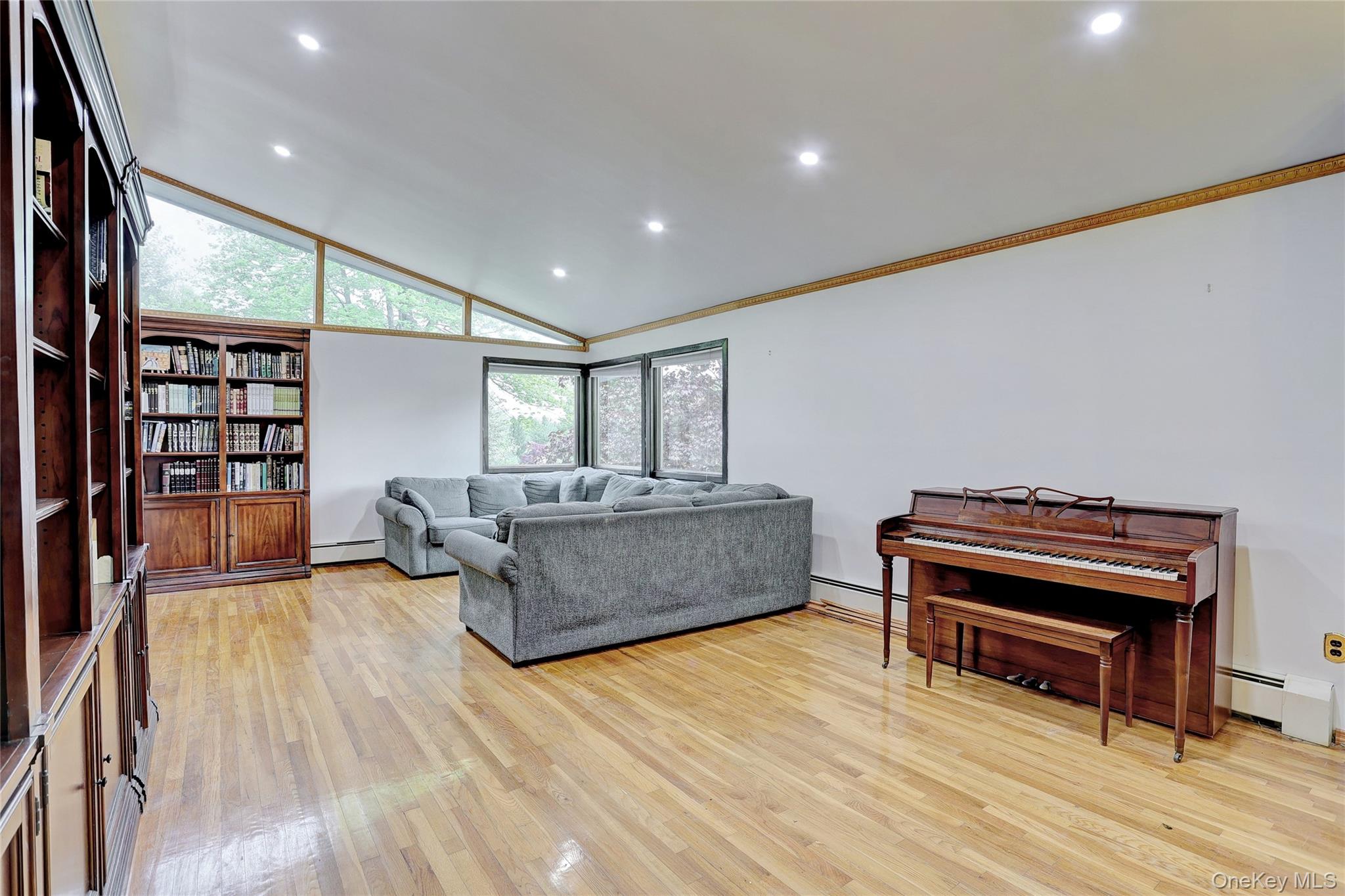 23 Sherwood Ridge Road Pomona, NY 10970 - Photo 4 of 28 a living room with furniture and a piano
