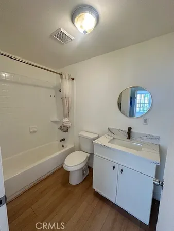a bathroom with a sink a toilet and a bathtub