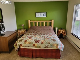 200 Southwest Florence Avenue, Unit C6 Gresham, OR 97080 - Photo 17 of 21 a bed sitting in a bedroom next to a window