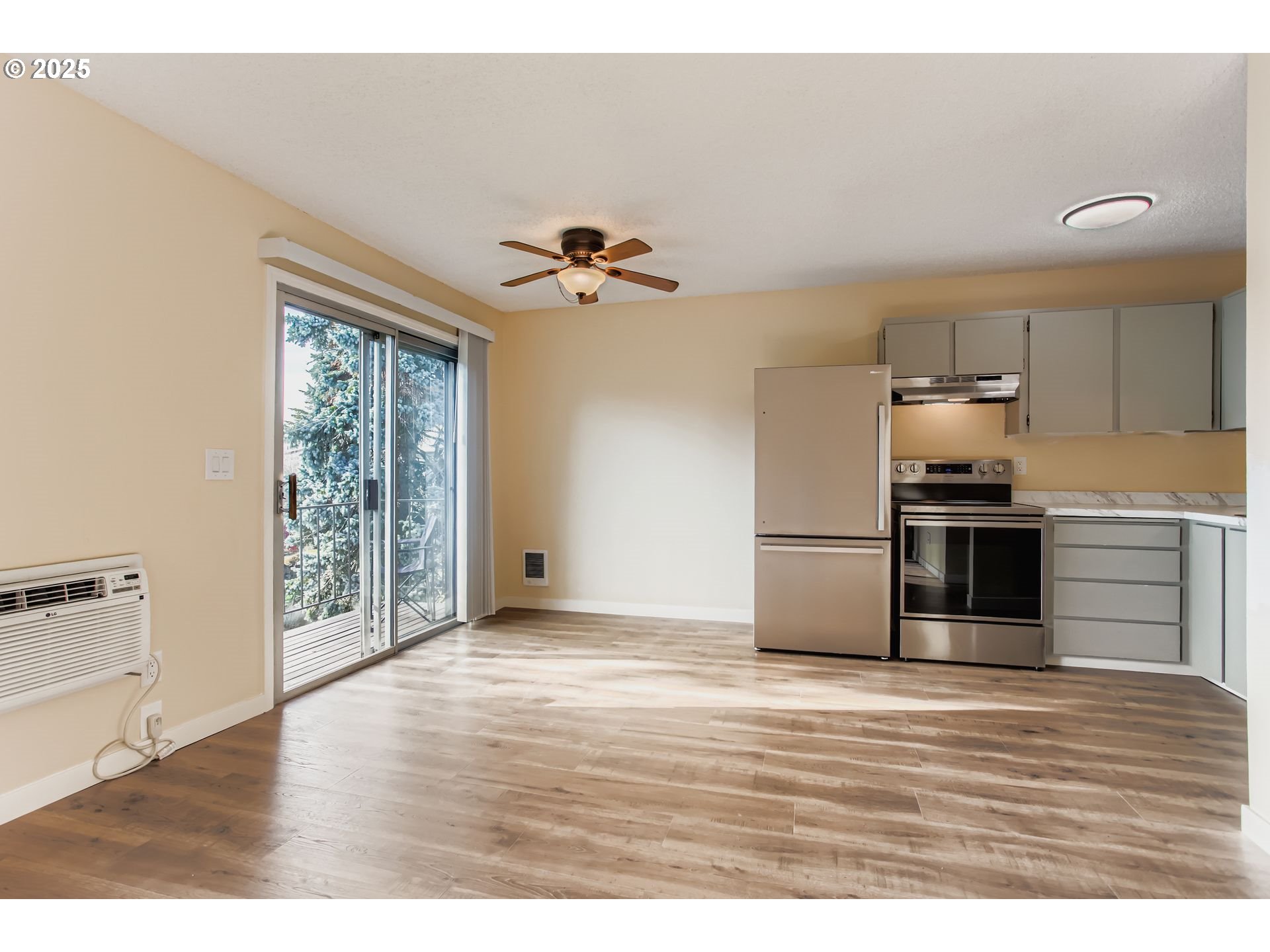 200 Southwest Florence Avenue, Unit C6 Gresham, OR 97080 - Photo 5 of 21 a view of a kitchen with a sink and a large window