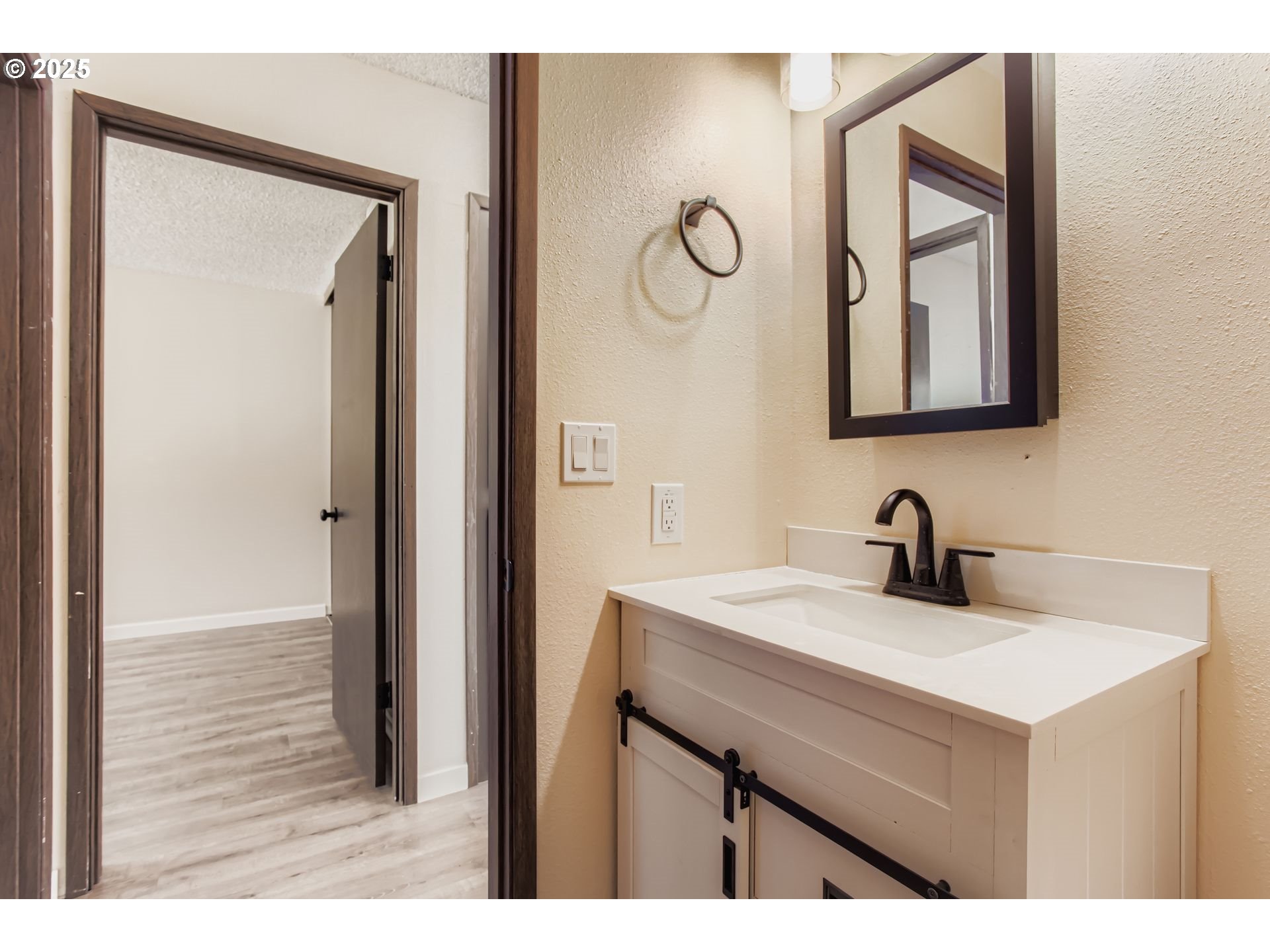 200 Southwest Florence Avenue, Unit C6 Gresham, OR 97080 - Photo 10 of 21 a bathroom with a sink vanity and a mirror