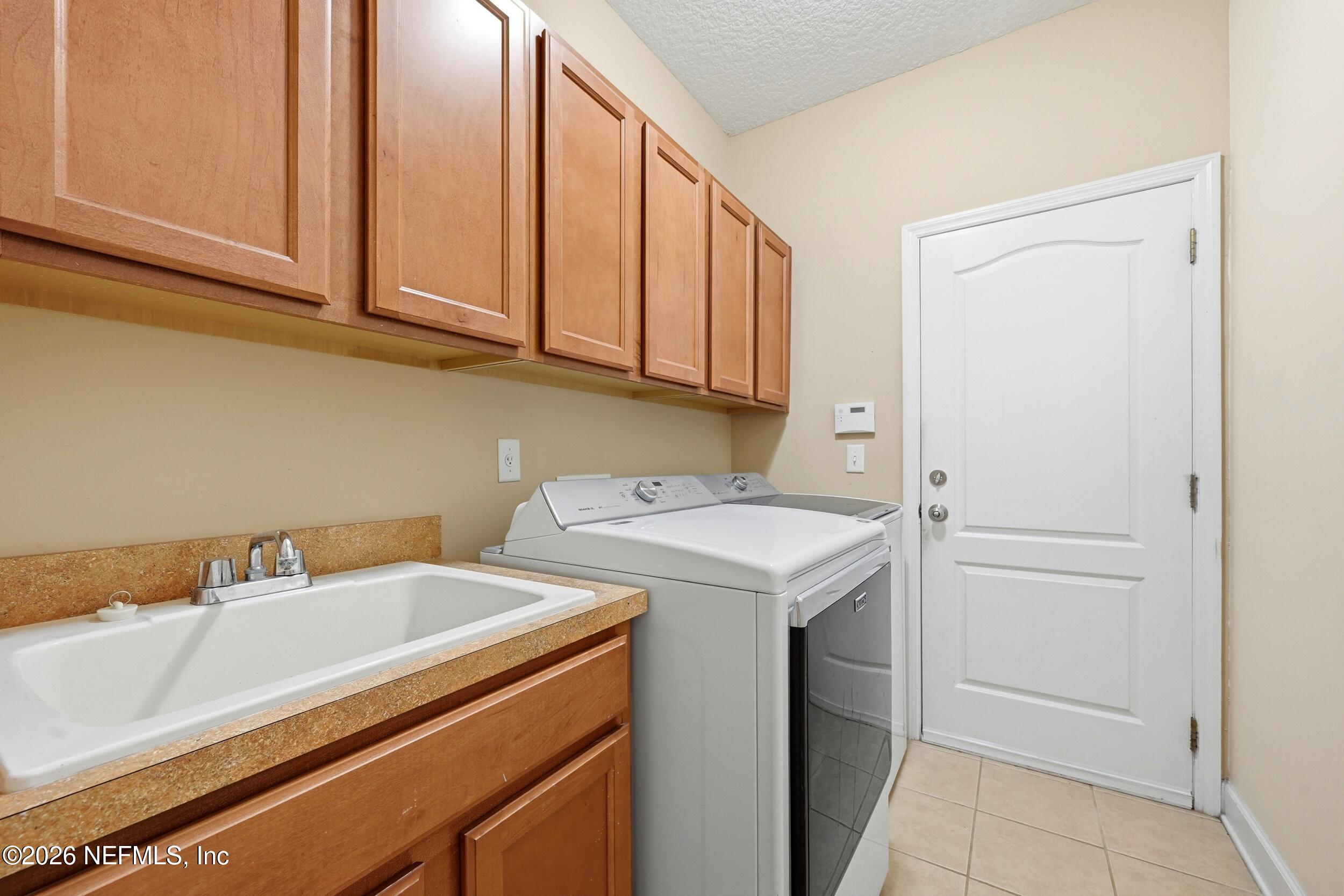 14478 Millhopper Road Jacksonville, FL 32258 - Photo 31 of 57 laundry room next to garage