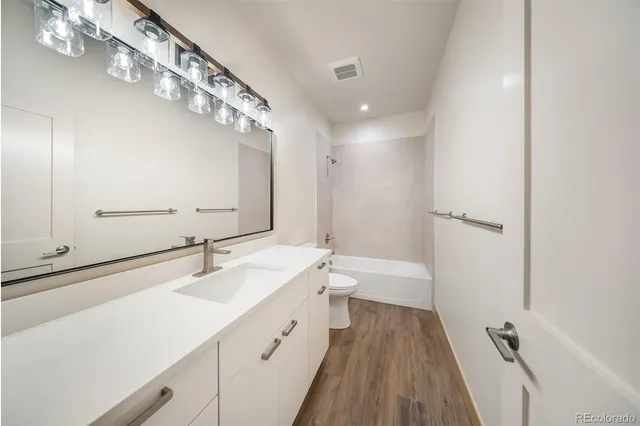 an empty room with a empty space and windows