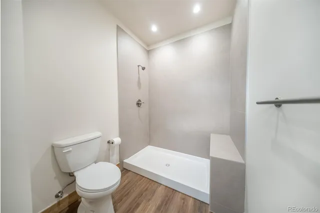 a view of an empty room with wooden walls