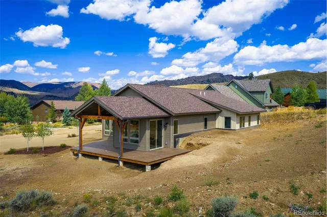 a view of a backyard with chairs