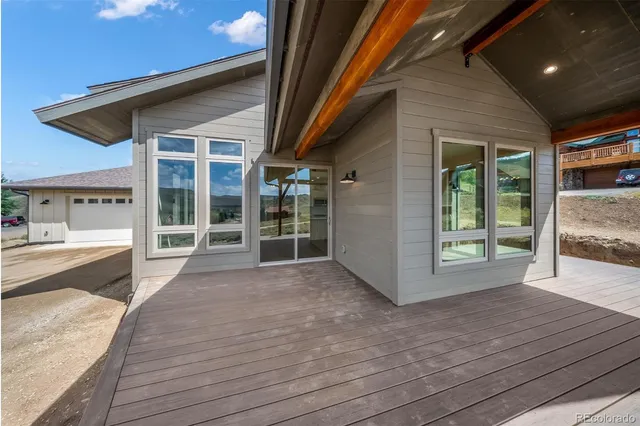 a view of a hallway view with wooden floor and staircase