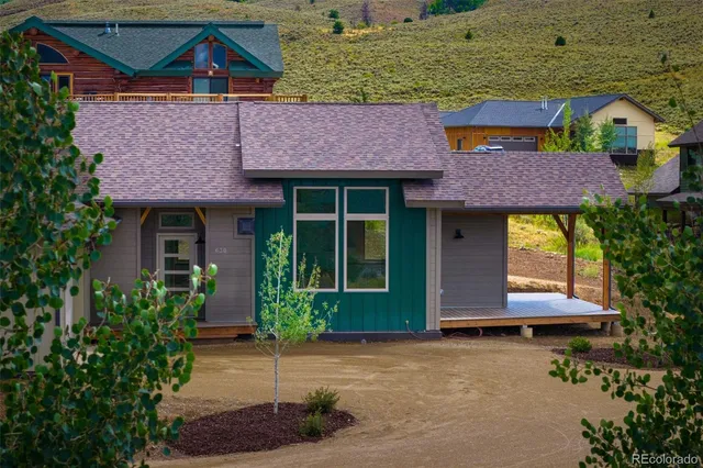 a front view of a house with yard