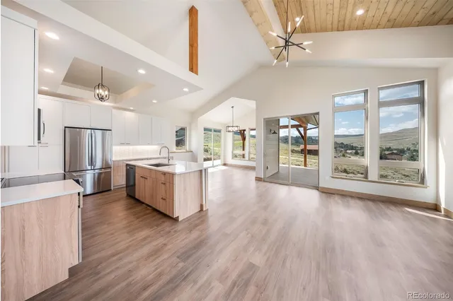 a view of a livingroom with a fireplace and cabinet