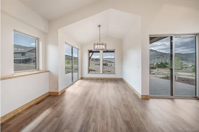a kitchen with appliances a sink and cabinets