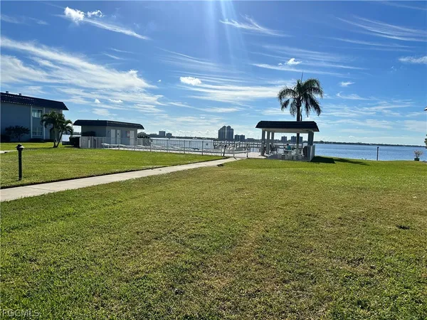 a view of a swimming pool and a yard