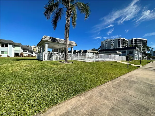 a view of a house with a yard porch and sitting area