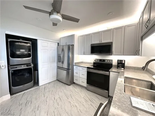 a kitchen with a refrigerator stove and microwave