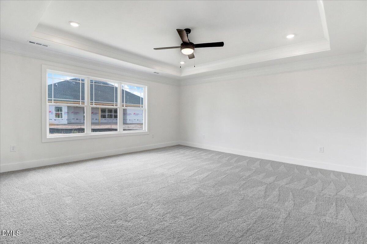 2 Galway Road Lillington, NC 27546 - Photo 16 of 37 an empty room with windows and ceiling fan