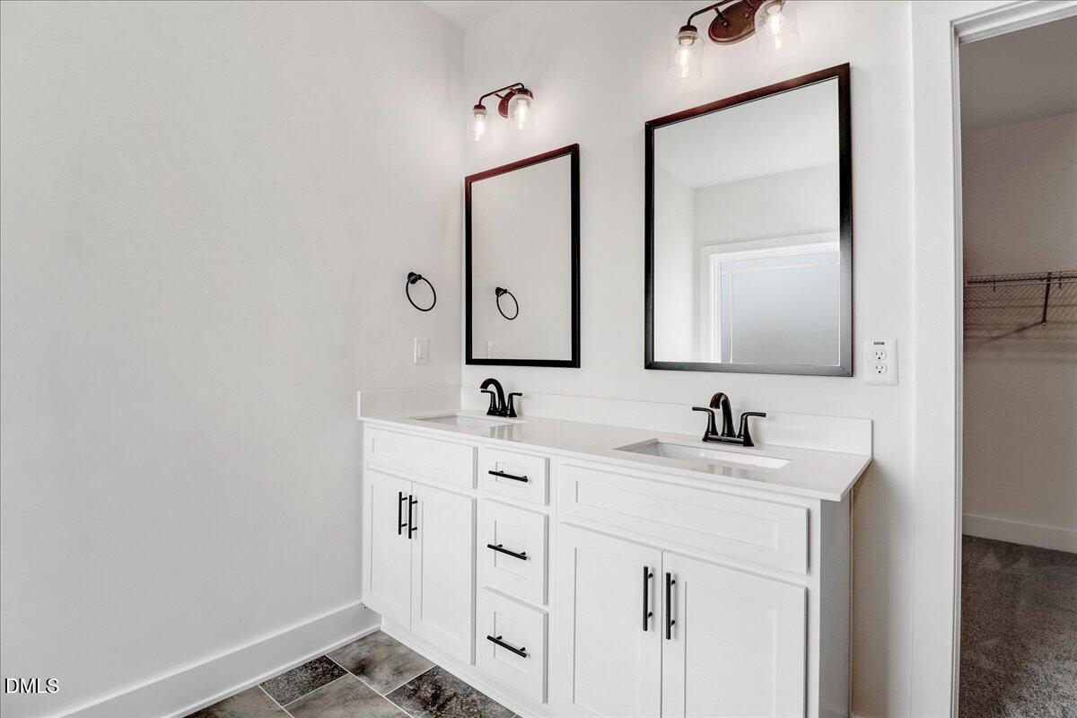 2 Galway Road Lillington, NC 27546 - Photo 19 of 37 a bathroom with a double vanity sink mirror and