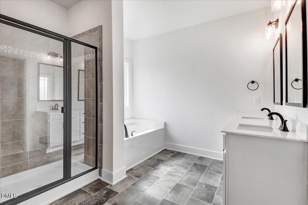 2 Galway Road Lillington, NC 27546 - Photo 20 of 37 a bathroom with a tub sink and mirror