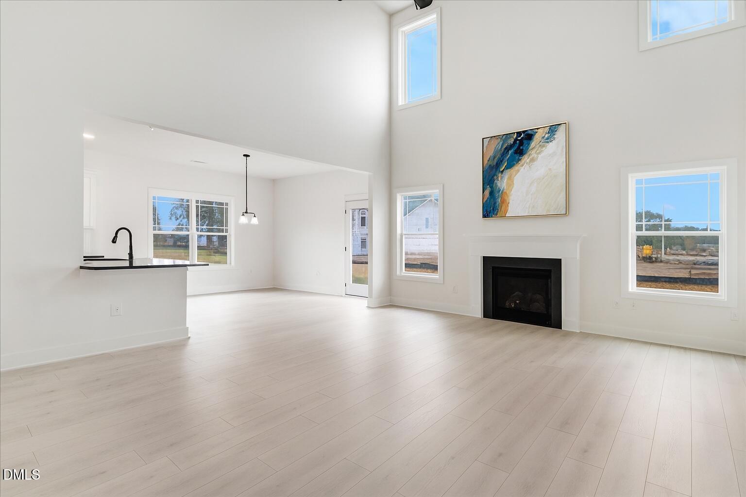 2 Galway Road Lillington, NC 27546 - Photo 6 of 37 a view of empty room with wooden floor and fireplace