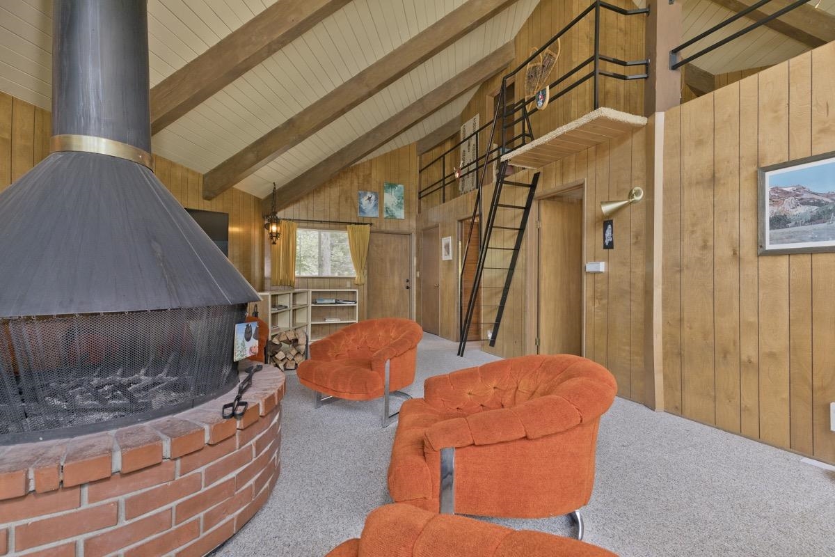 2563 Old Mammoth Road Mammoth Lakes, CA 93546 - Photo 26 of 49 a living room with furniture and a fireplace