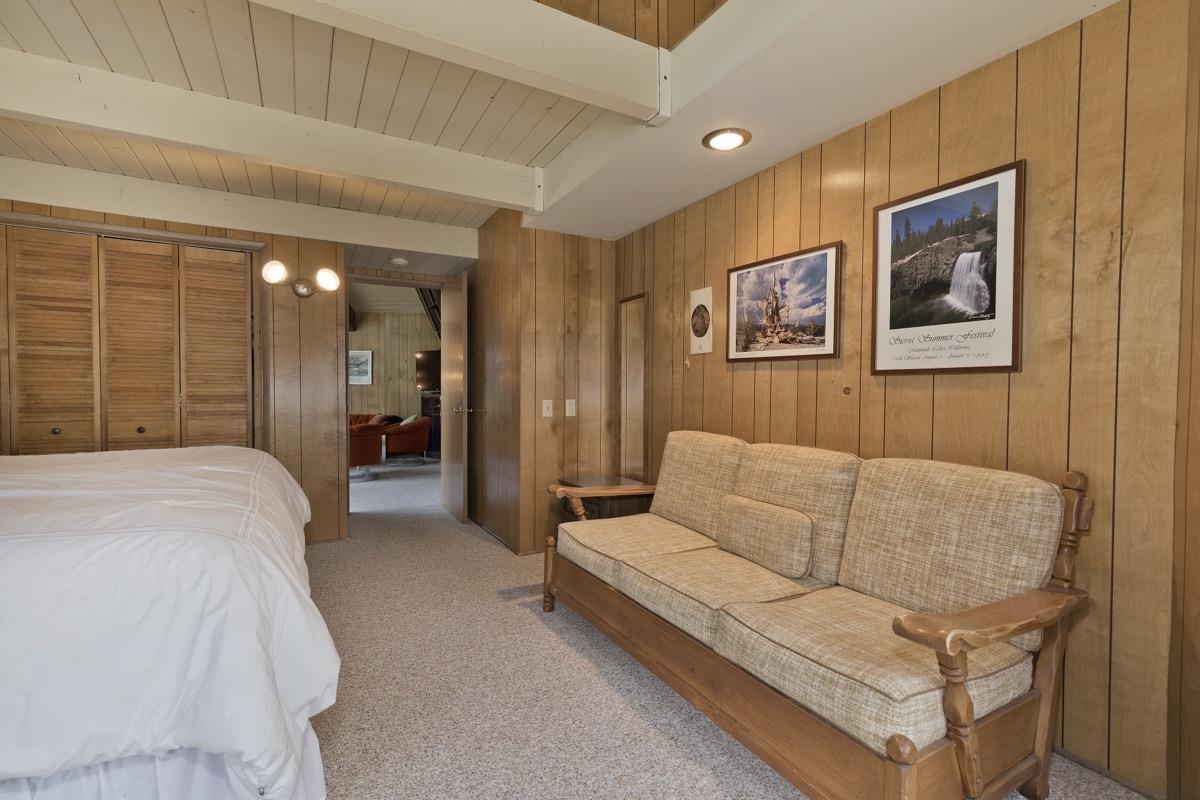 2563 Old Mammoth Road Mammoth Lakes, CA 93546 - Photo 31 of 49 a spacious bedroom with a bed and a couch