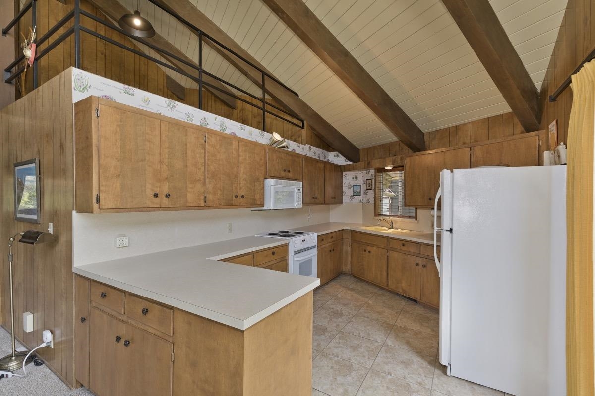 2563 Old Mammoth Road Mammoth Lakes, CA 93546 - Photo 34 of 49 a kitchen that has a sink a refrigerator and a stove
