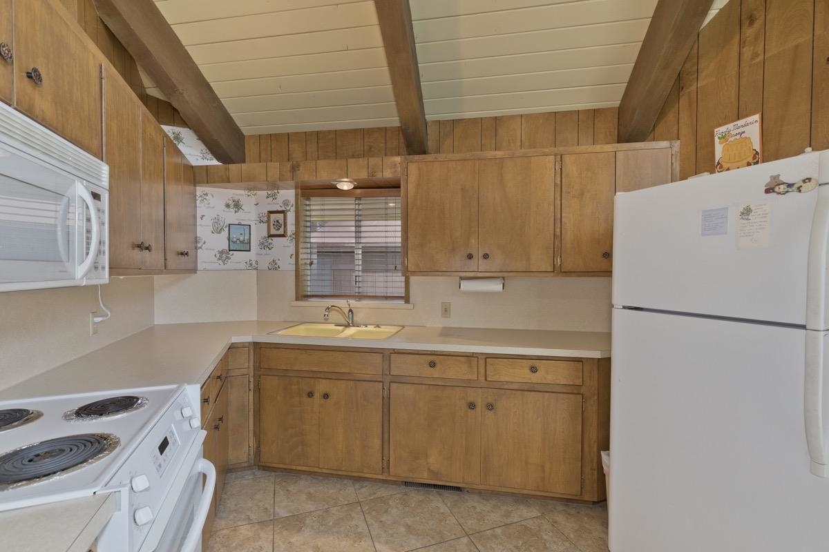 2563 Old Mammoth Road Mammoth Lakes, CA 93546 - Photo 35 of 49 a utility room with cabinets washer and dryer