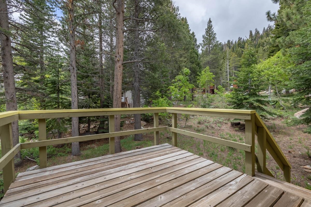 2563 Old Mammoth Road Mammoth Lakes, CA 93546 - Photo 42 of 49 a view of balcony with wooden floor and fence