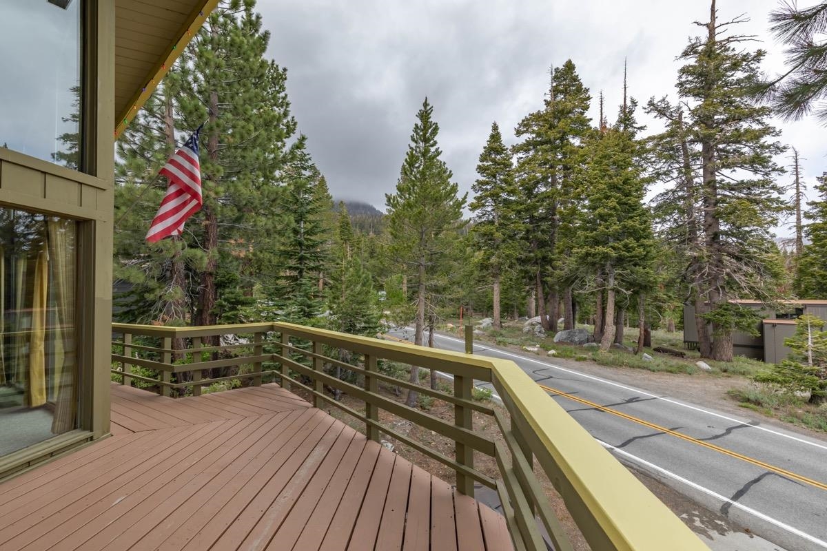 2563 Old Mammoth Road Mammoth Lakes, CA 93546 - Photo 47 of 49 a view of a balcony with wooden floor and trees
