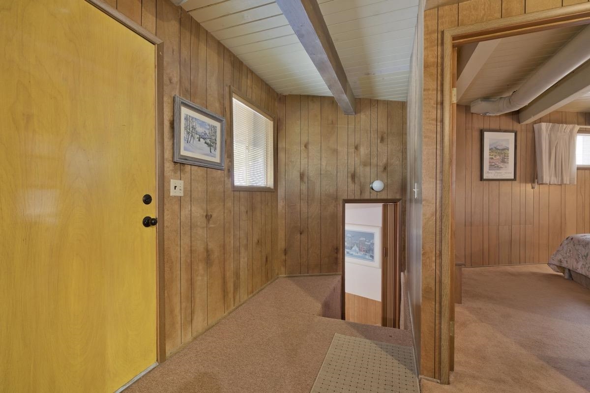 2563 Old Mammoth Road Mammoth Lakes, CA 93546 - Photo 5 of 49 a view of a hallway with wooden shelves
