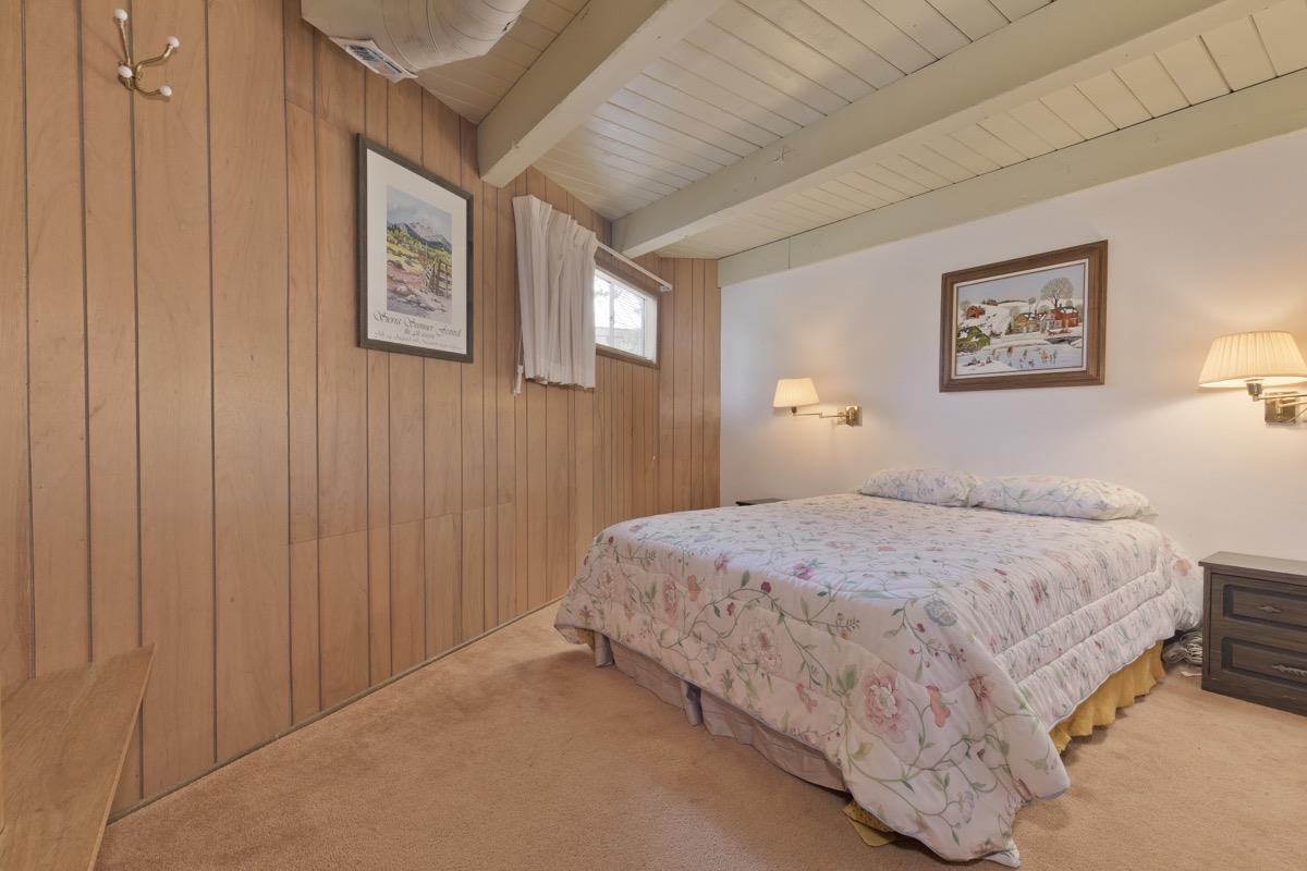 2563 Old Mammoth Road Mammoth Lakes, CA 93546 - Photo 8 of 49 a bedroom with a bed and wall painting