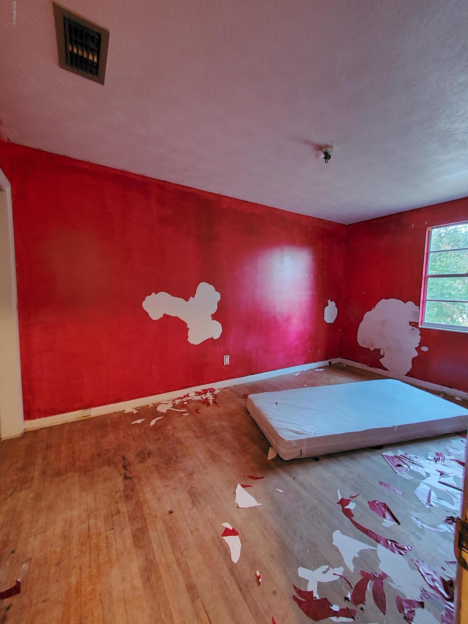 926 Bert Road Jacksonville, FL 32211 - Photo 4 of 7 a room with a bed