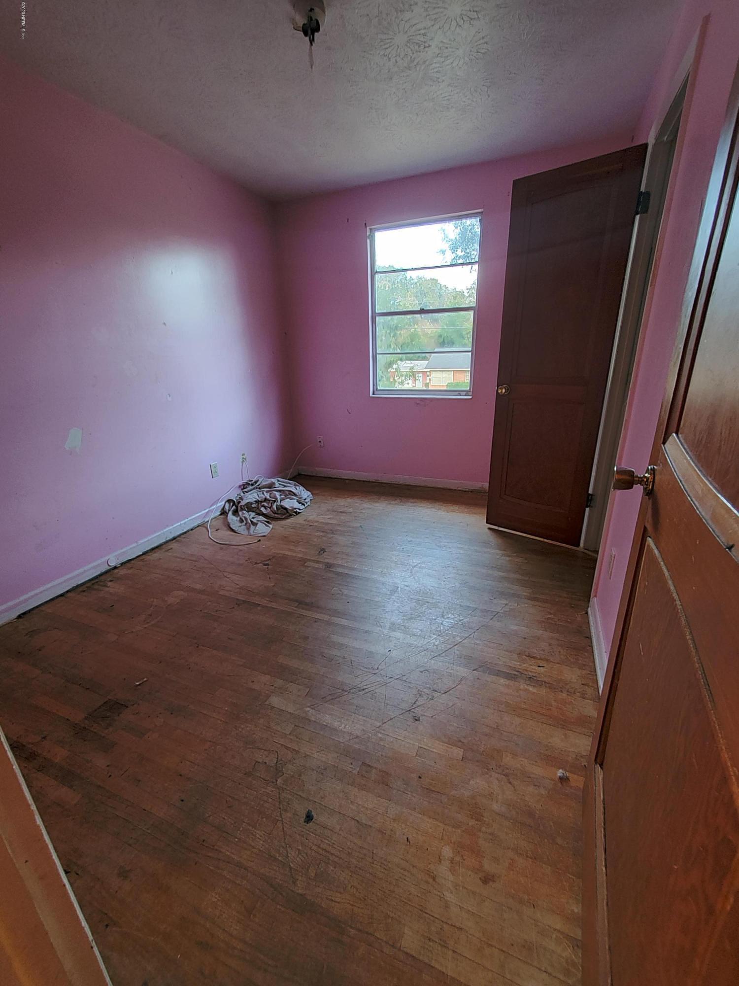 926 Bert Road Jacksonville, FL 32211 - Photo 5 of 7 an empty room with windows