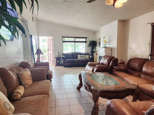 a living room with furniture and a window