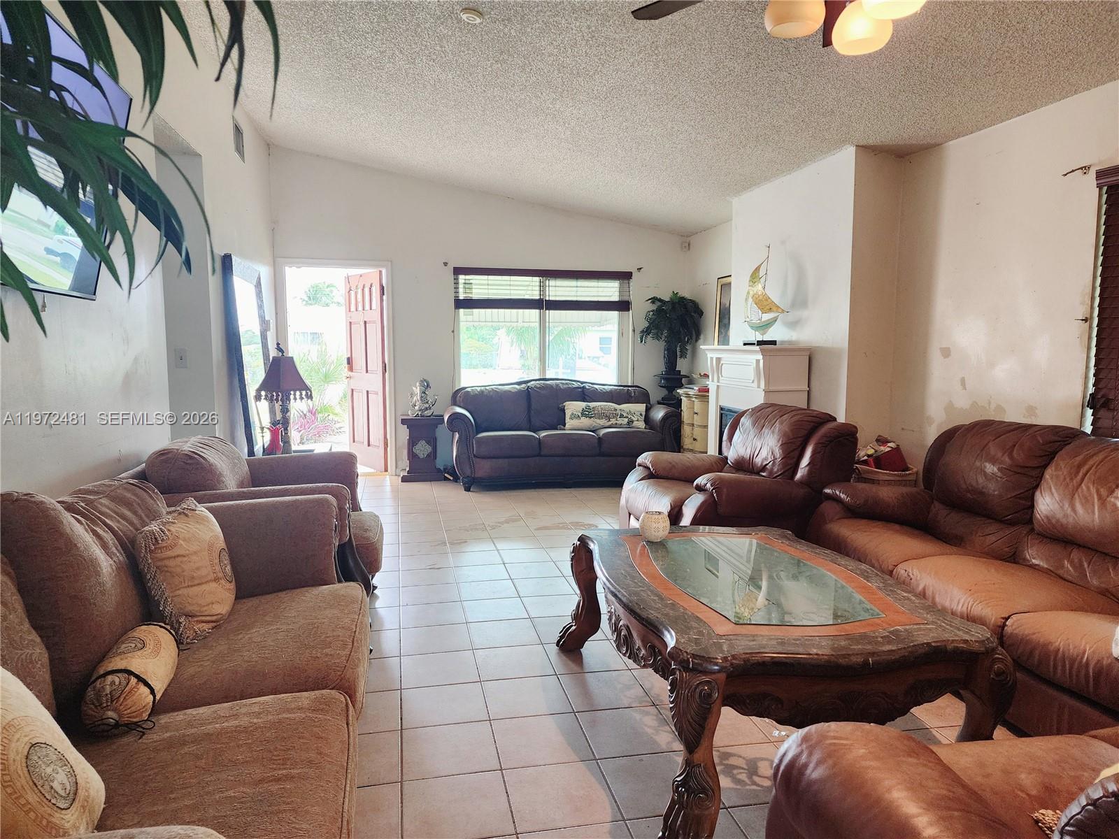 2623 Harding Street Hollywood, FL 33020 - Photo 3 of 12 a living room with furniture and a window