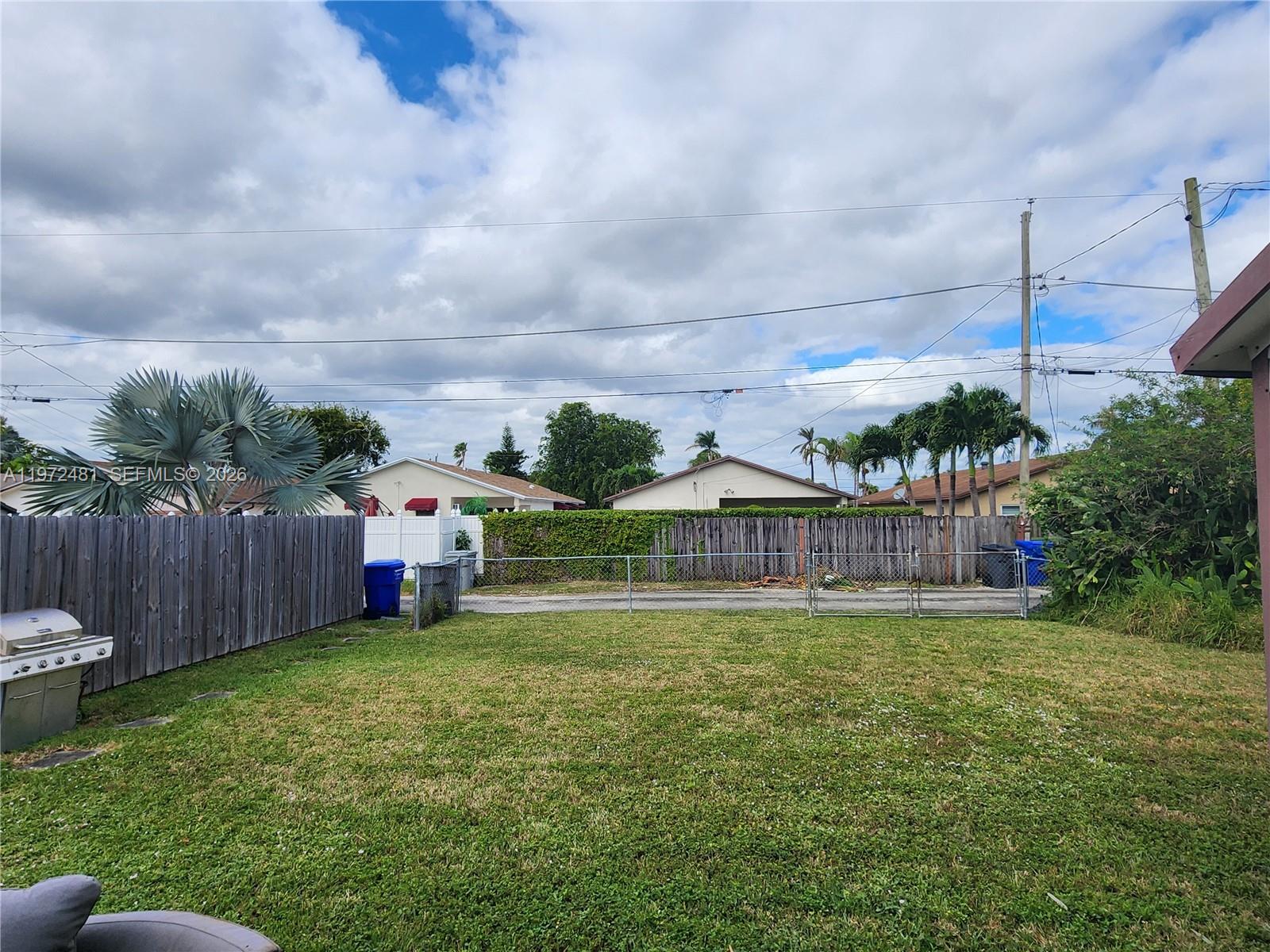 2623 Harding Street Hollywood, FL 33020 - Photo 9 of 12 a view of a house with a yard and sitting area