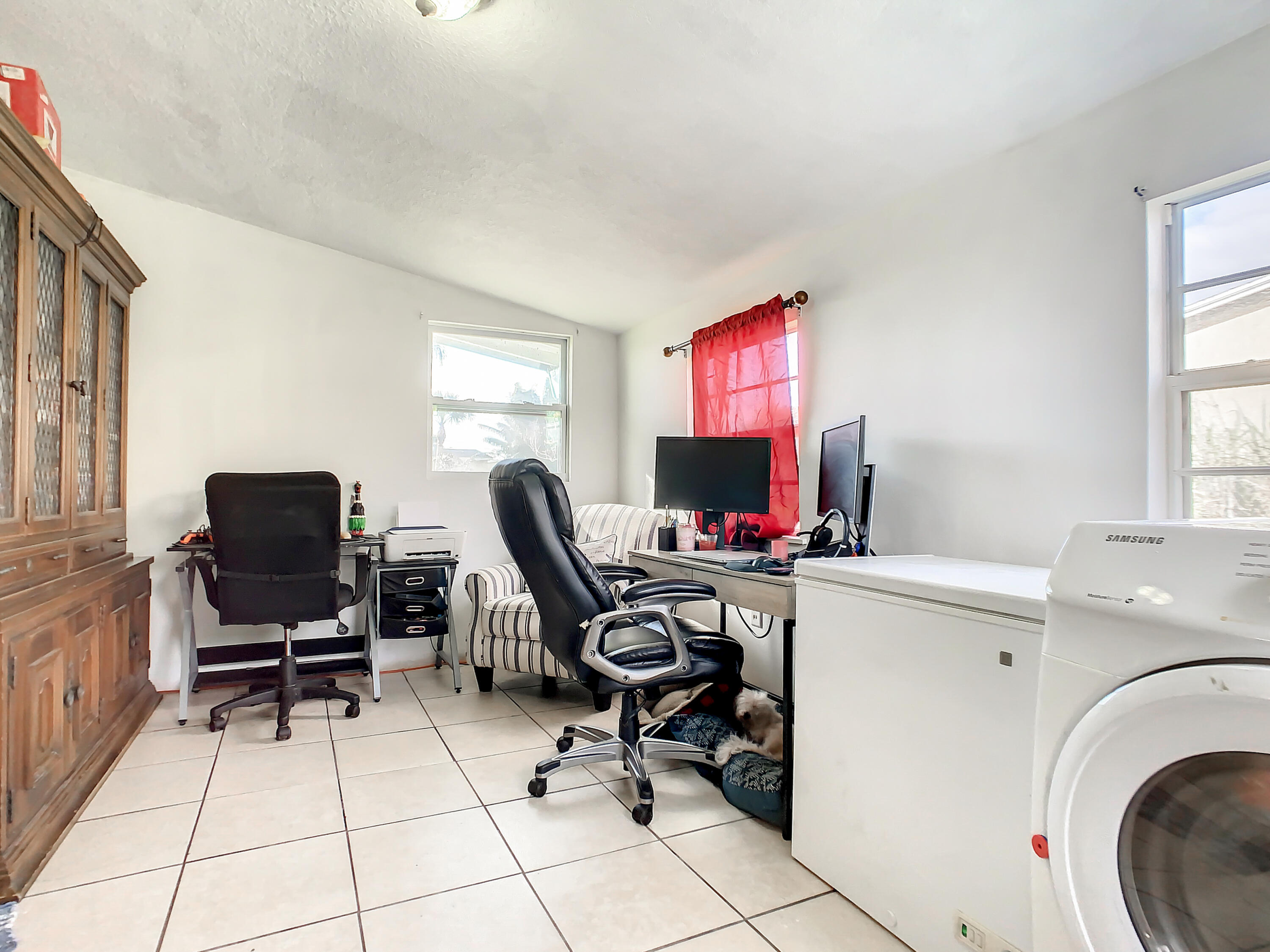 1956 Nottingham Road Melbourne, FL 32935 - Photo 12 of 32 a view of a workspace with furniture and a window