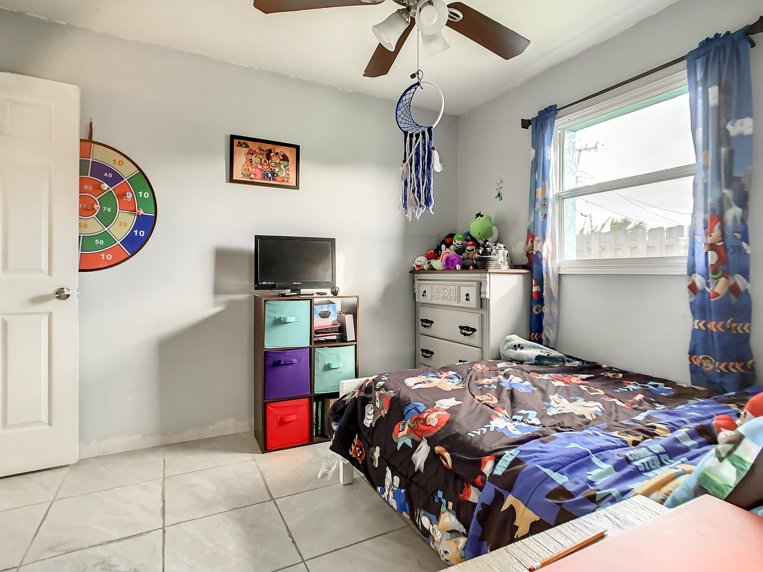 1956 Nottingham Road Melbourne, FL 32935 - Photo 13 of 32 a bedroom with a bed and window
