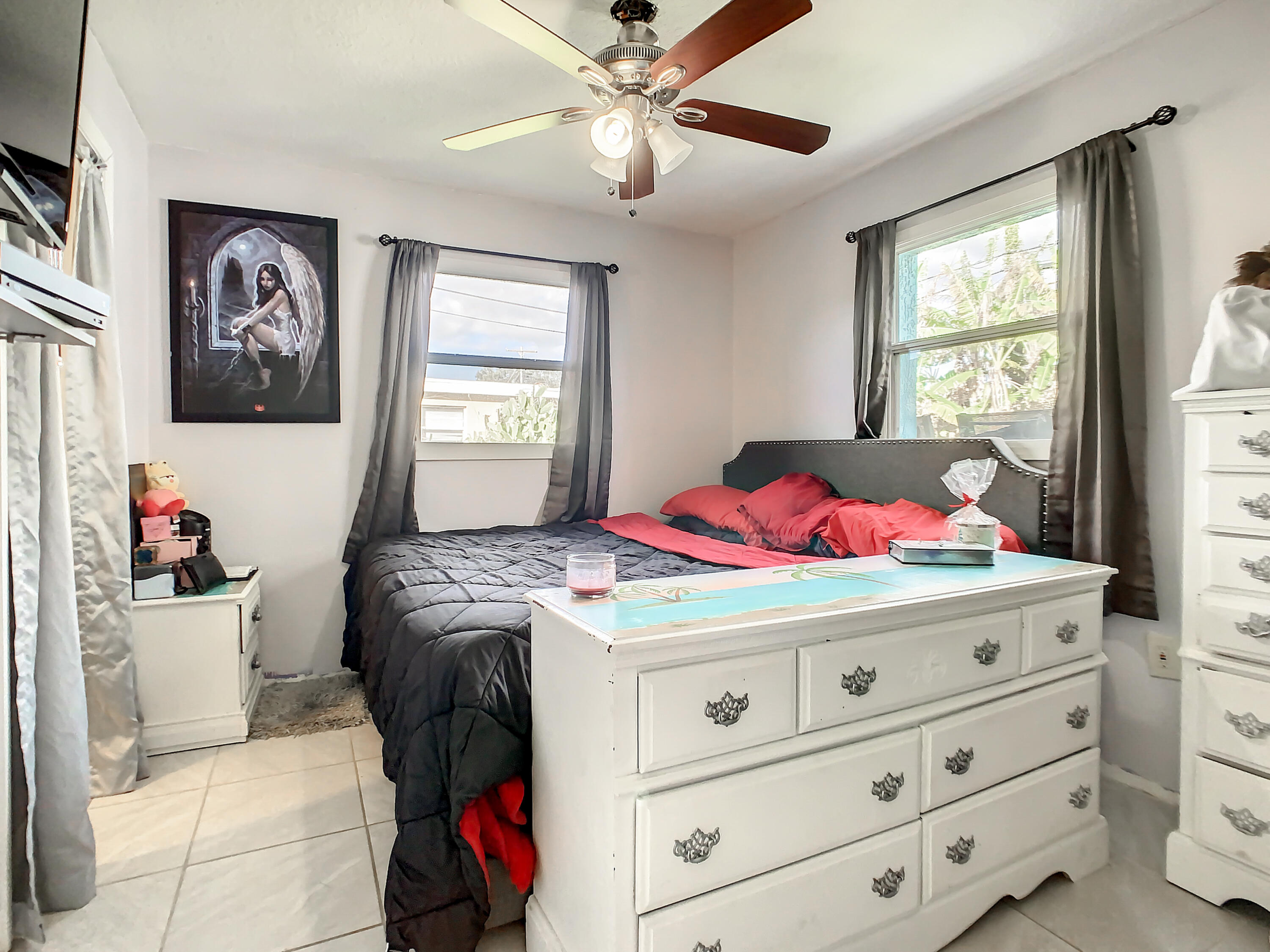 1956 Nottingham Road Melbourne, FL 32935 - Photo 18 of 32 a bedroom with a bed and a window