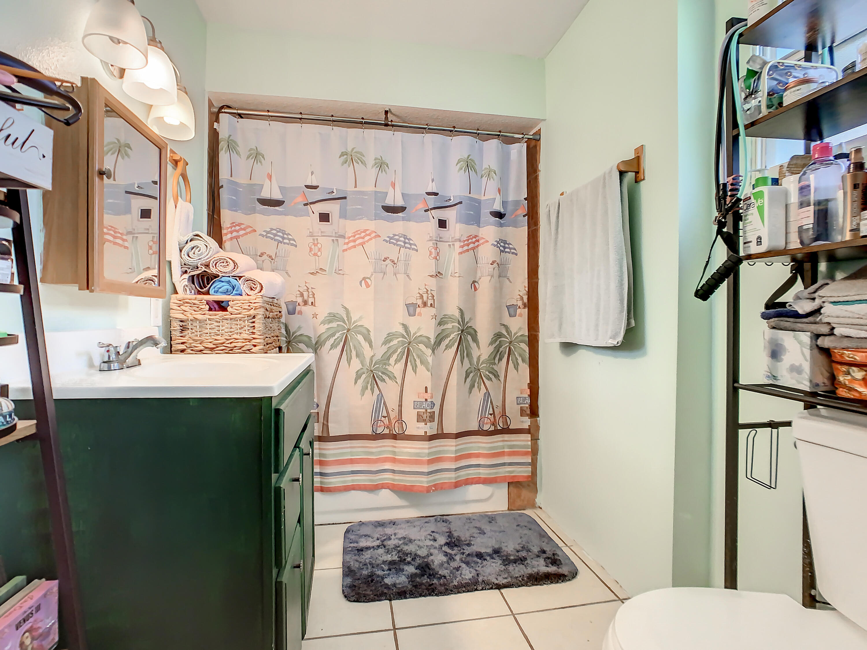 1956 Nottingham Road Melbourne, FL 32935 - Photo 20 of 32 a bathroom with a sink a toilet and shower