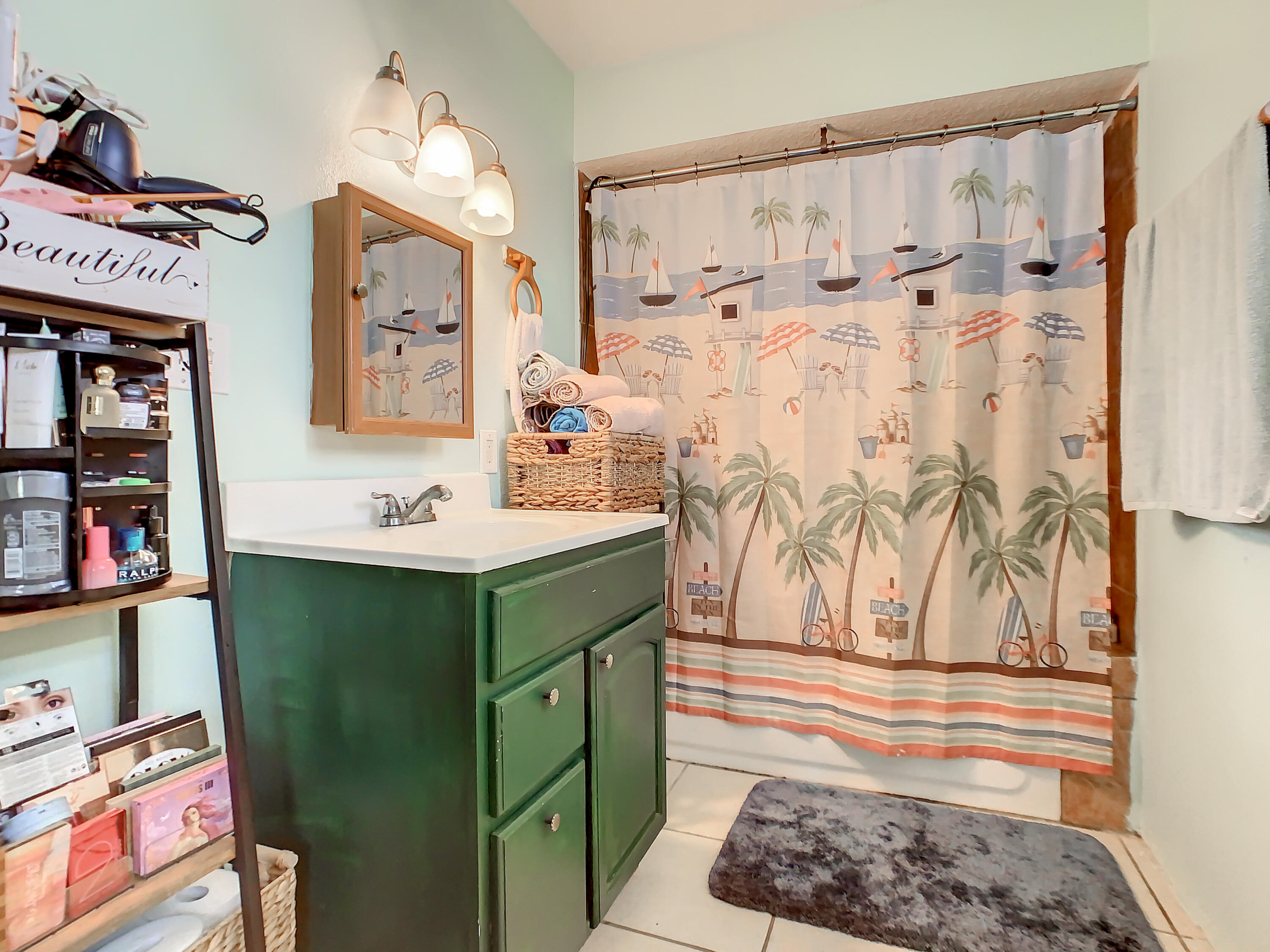 1956 Nottingham Road Melbourne, FL 32935 - Photo 21 of 32 a bathroom with a sink toilet and shower