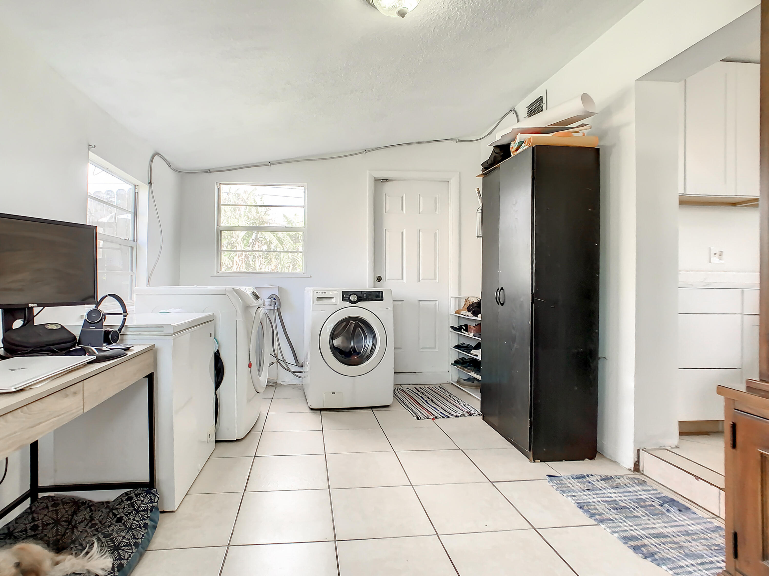 1956 Nottingham Road Melbourne, FL 32935 - Photo 24 of 32 a utility room with closet dryer and washer