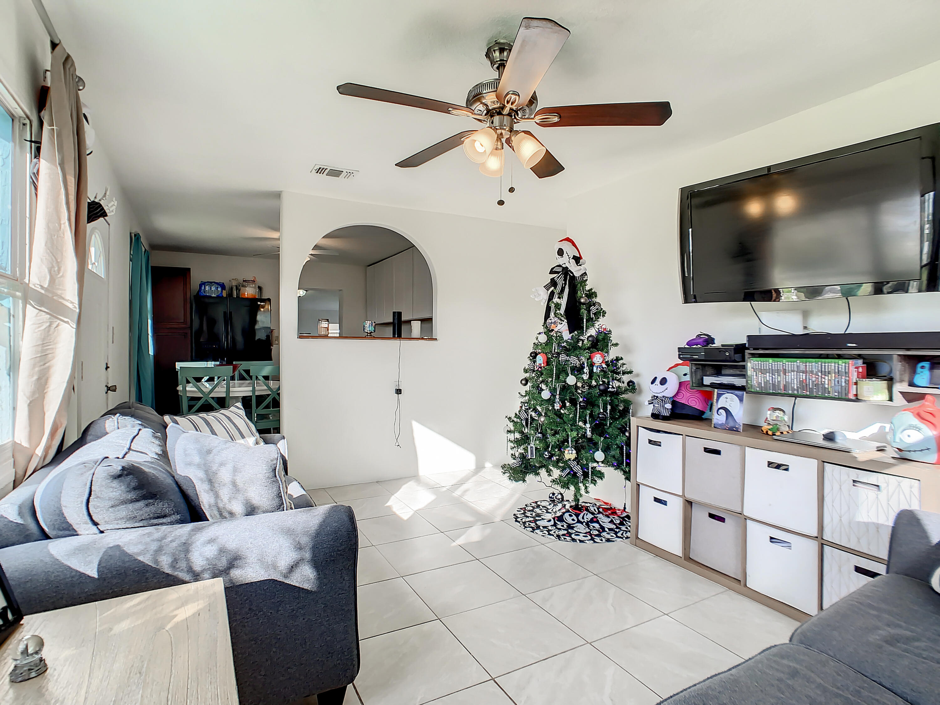 1956 Nottingham Road Melbourne, FL 32935 - Photo 6 of 32 a living room with furniture and a flat screen tv