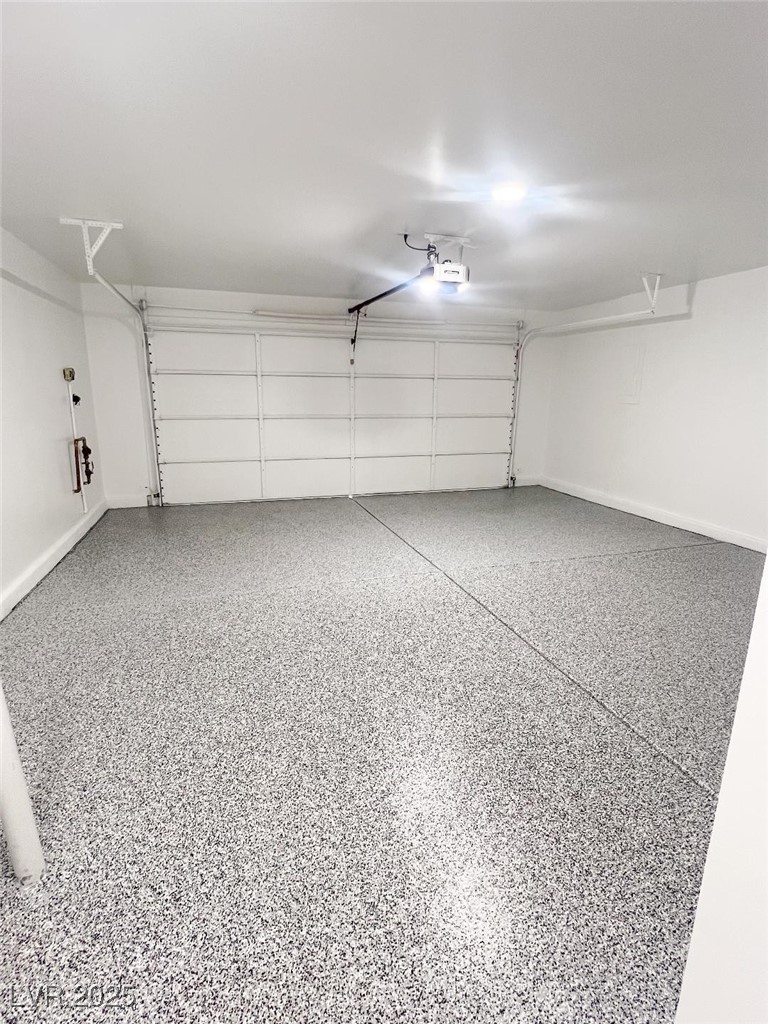 502 Edgefield Ridge Place Henderson, NV 89012 - Photo 30 of 38 Garage featuring baseboards and a garage door opener