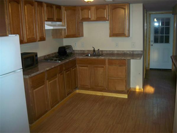 203 Mary Coburn Road Springfield, MA 01129 - Photo 15 of 30 a kitchen with granite countertop a sink cabinets and stainless steel appliances