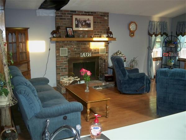 203 Mary Coburn Road Springfield, MA 01129 - Photo 5 of 30 a living room with furniture and a fireplace