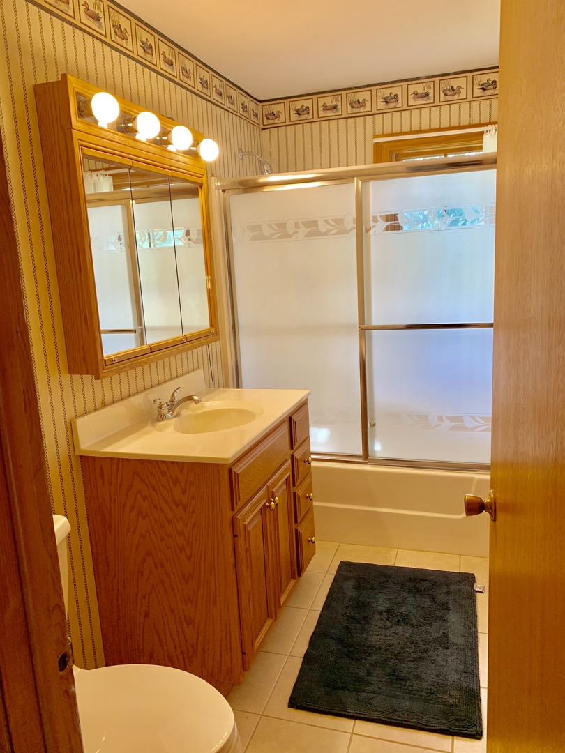 2785 Shannon Road Northbrook, IL 60062 - Photo 12 of 21 a bathroom with a sink a toilet and shower